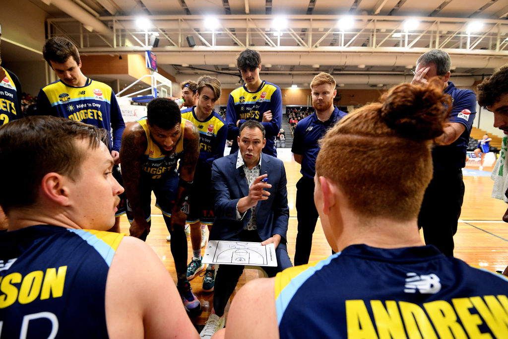 Otago Nuggets coach Brent Matehaere talks to his players during the game against the Nelson...