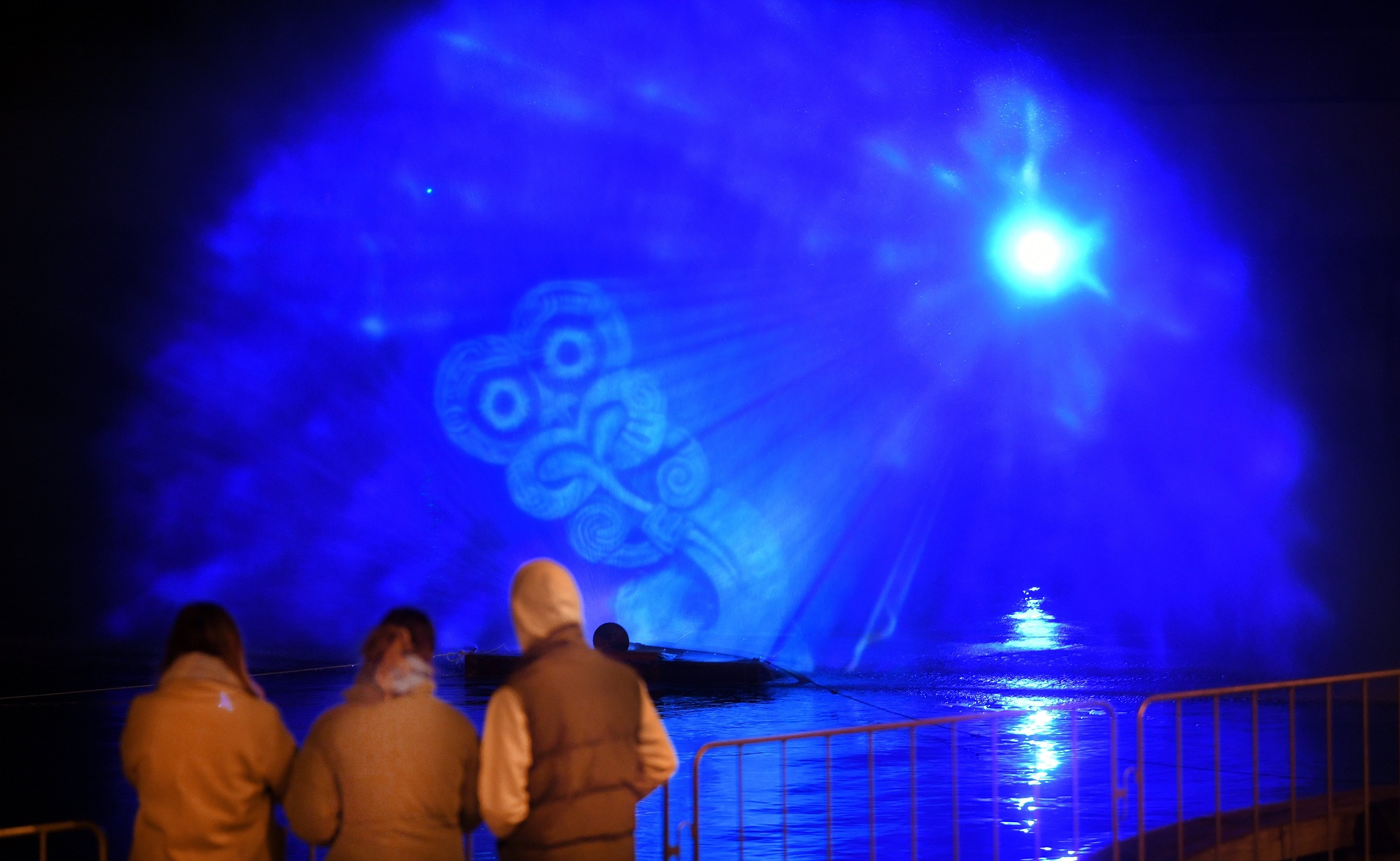 People watch a preview of the Matariki immersive show on Otago Harbour. Over three nights, water...