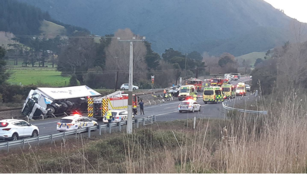 Emergency services at the scene of the crash yesterday. Photo: Trish Rawlings