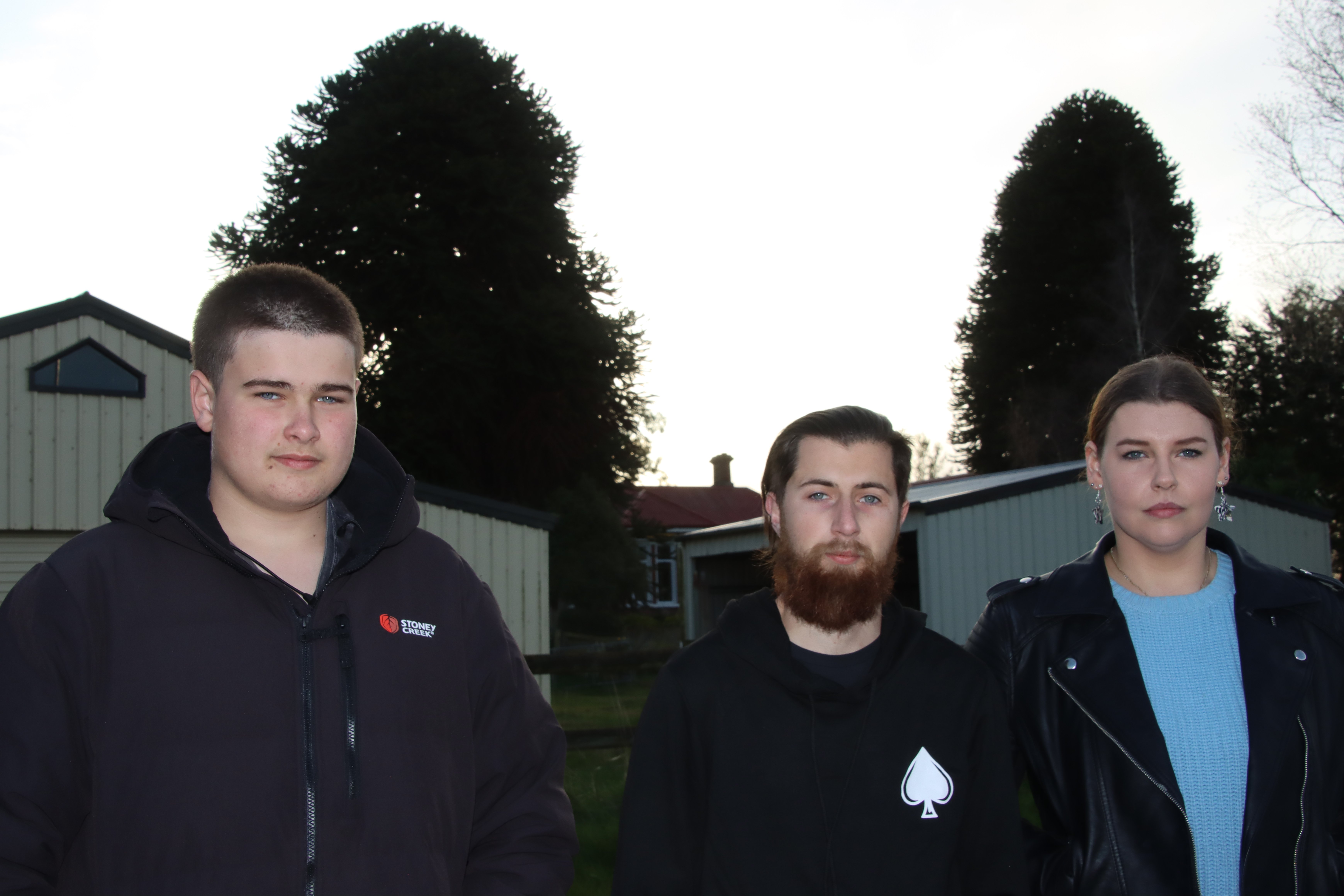 Gore residents (from left) Toby Johnston (15), Josh Johnston and Erika van Dam stand outside the...