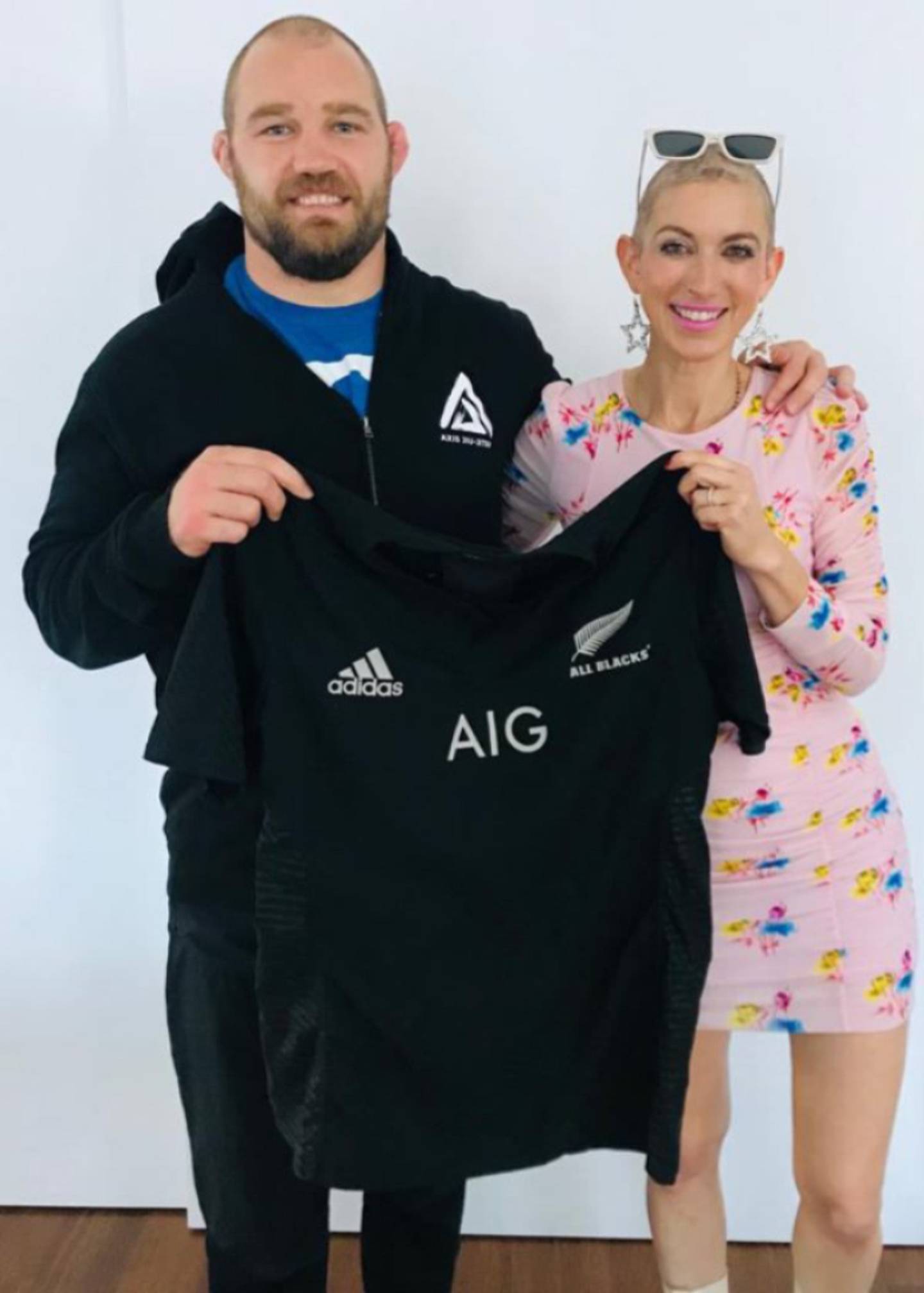 Owen Franks and Missy Terpstra with the jersey. Photo: NZ Herald 