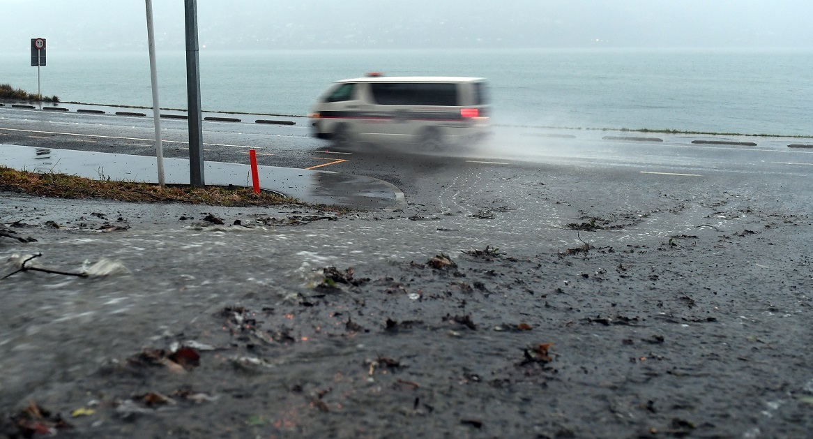 Motorists ploughed through a river of water flowing down St Ronans Rd on to Portobello Rd as rain...