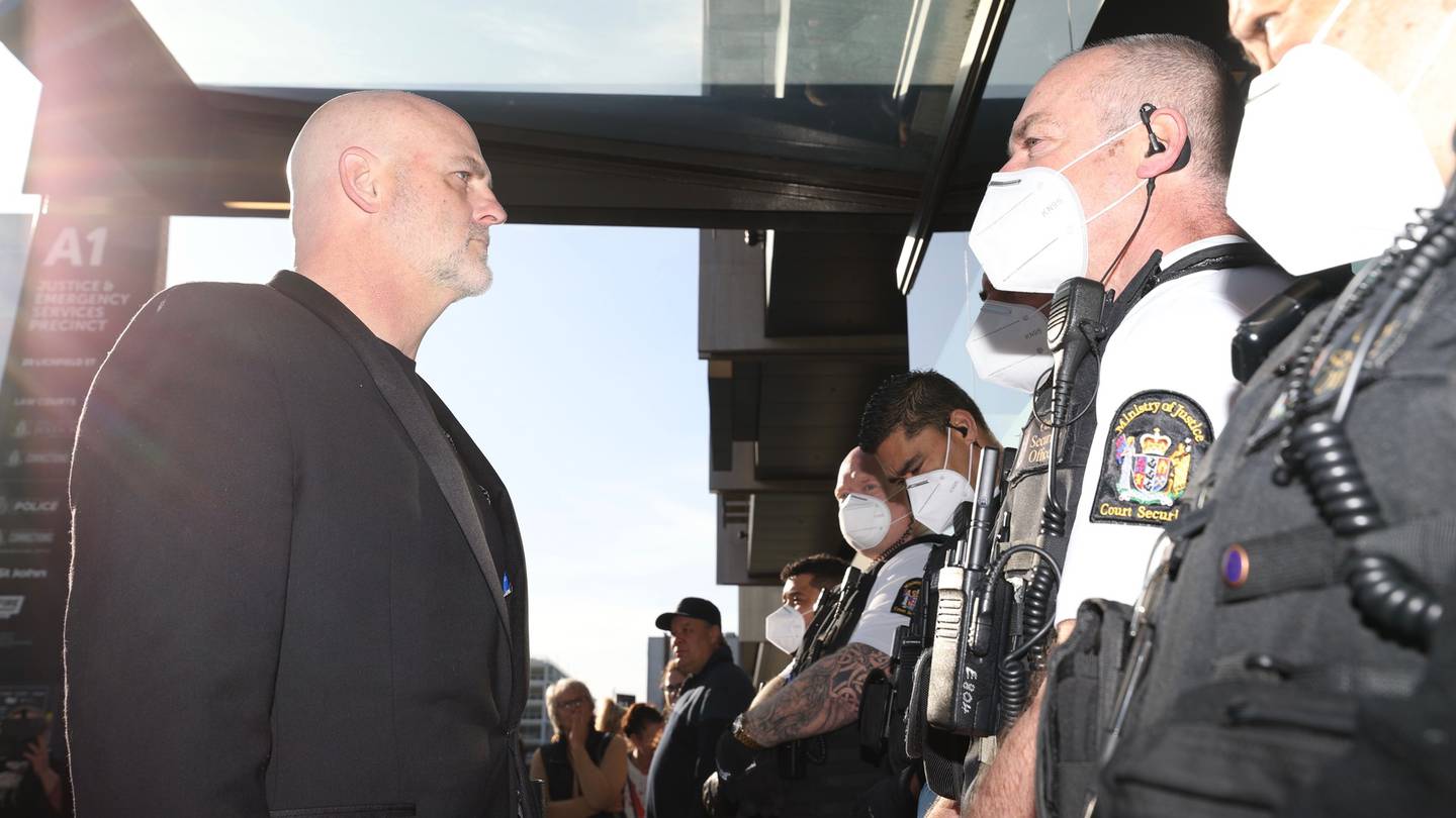 Kelvyn Alp faces off with security outside the Christchurch District Court. Photo: George Heard