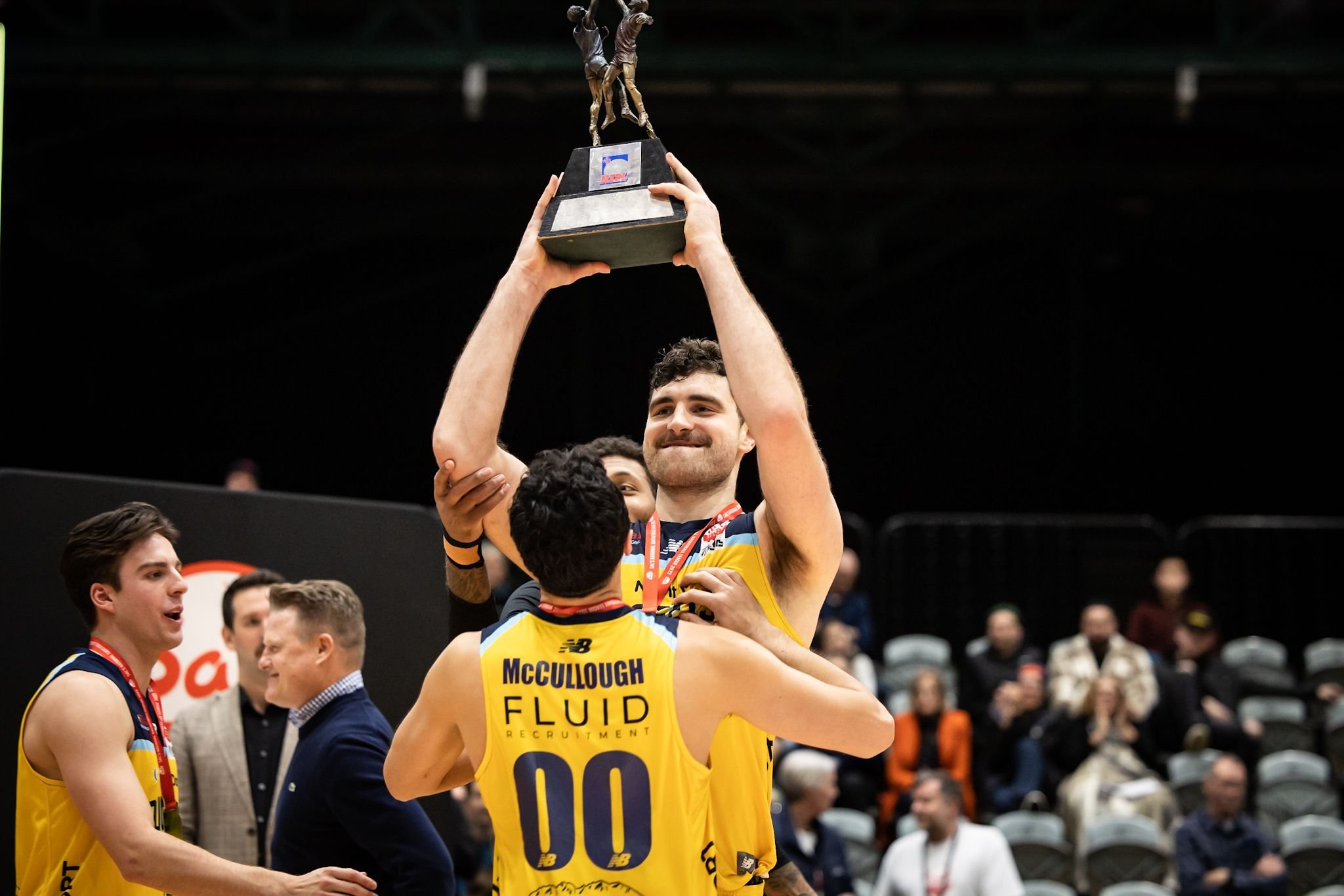 Nuggets captain Sam Timmins holds the trophy as he and teammates celebrate the win. Photo:...