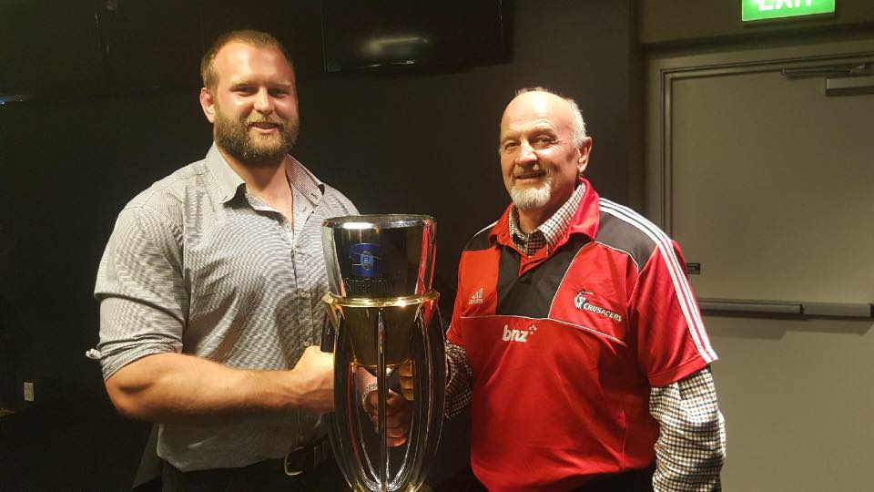 Joe Moody with his dad Tony Moody with the Super Rugby Trophy. Photo: Supplied