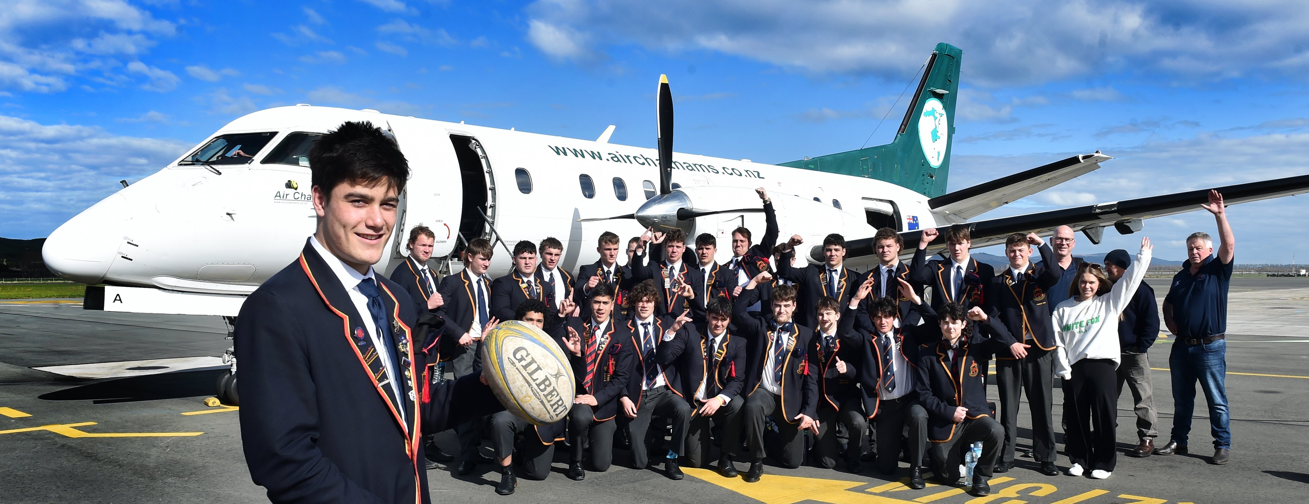 Jack Timu (left) and the John McGlashan College First XV prepare to fly to Nelson yesterday....