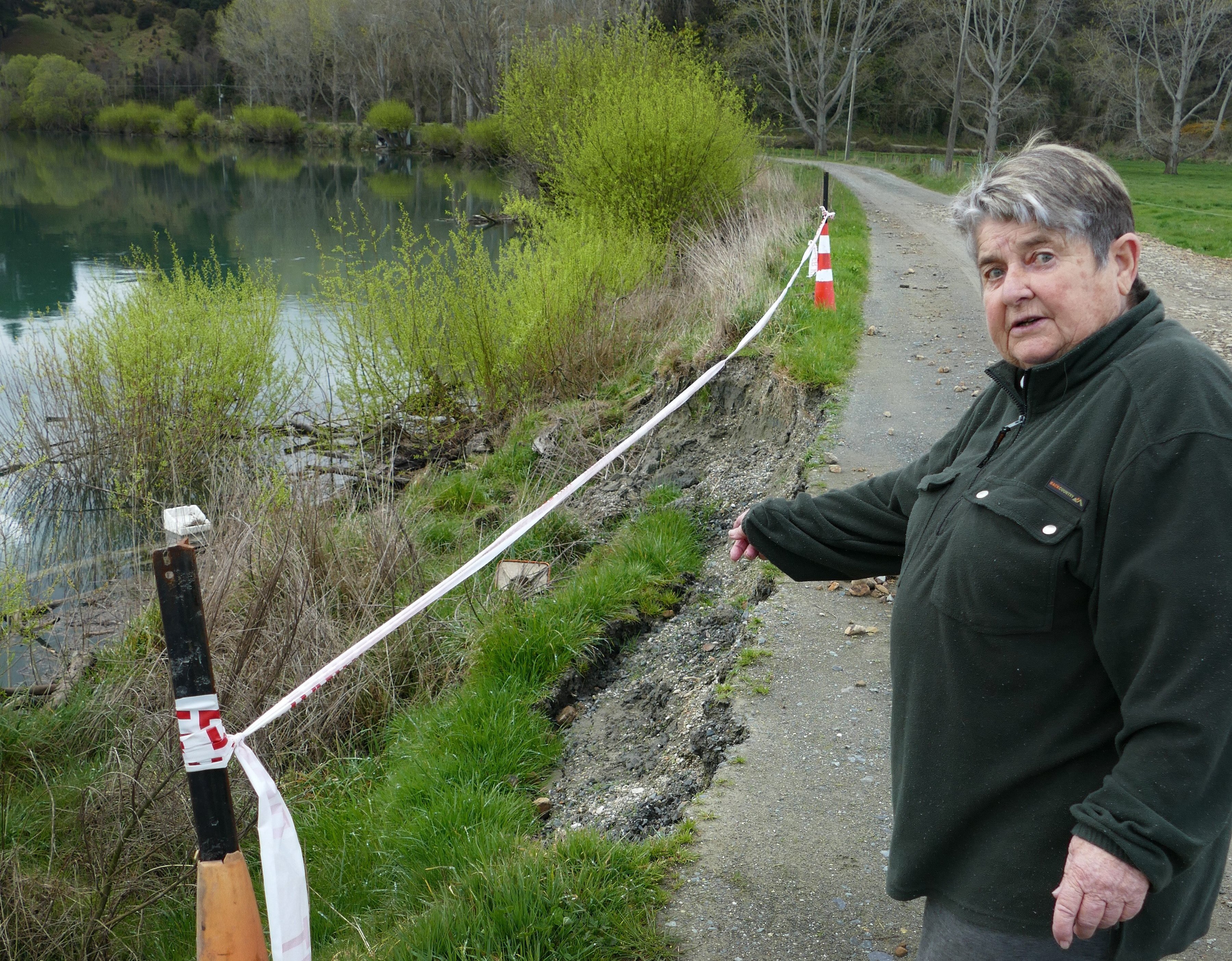 Kaitangata retiree Ann Manning points out erosion of the bank of the Clutha River she says has...