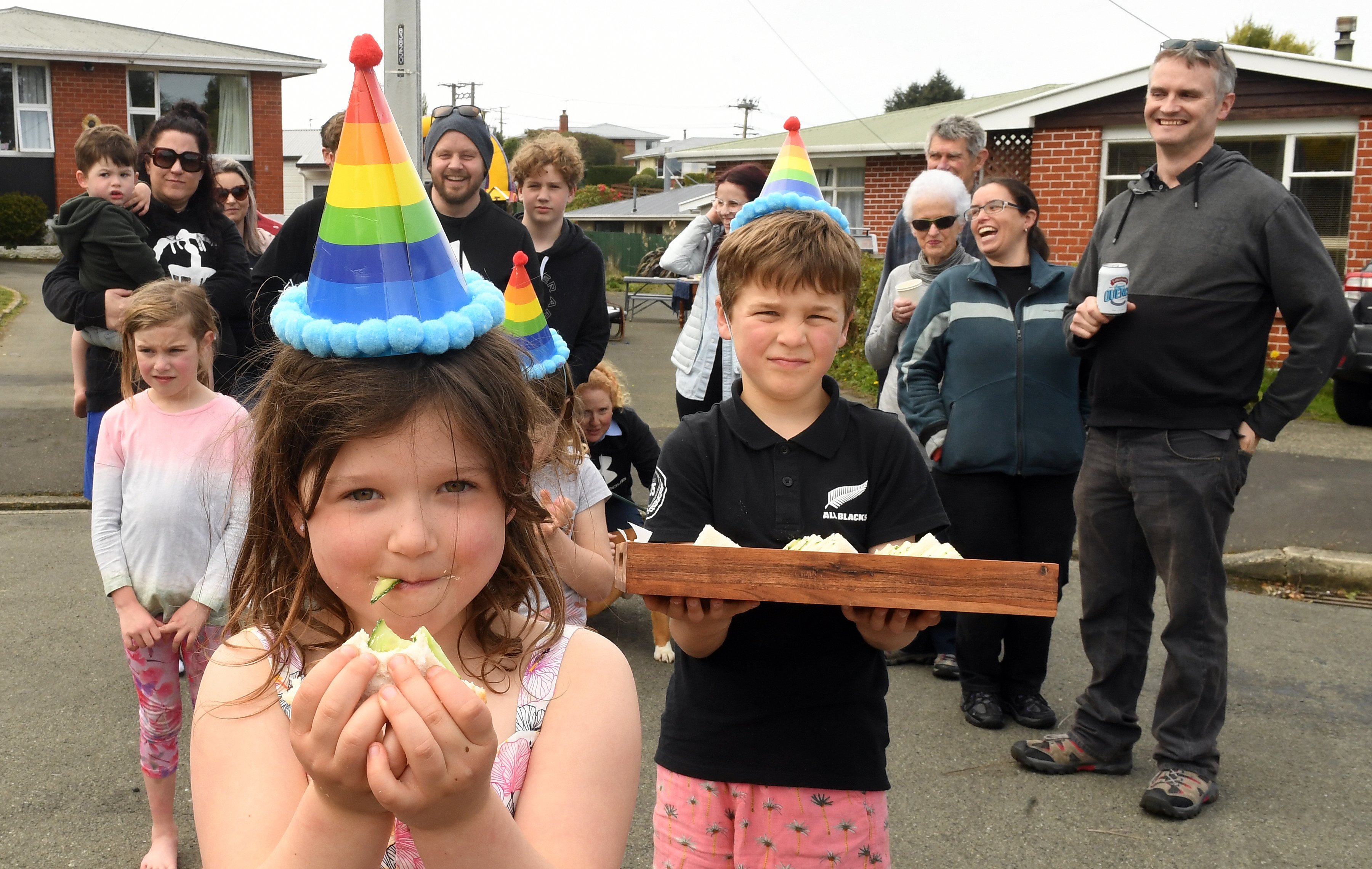 Marley Day (6) enjoys a cucumber sandwich with other Fenwick St residents who had a street party...