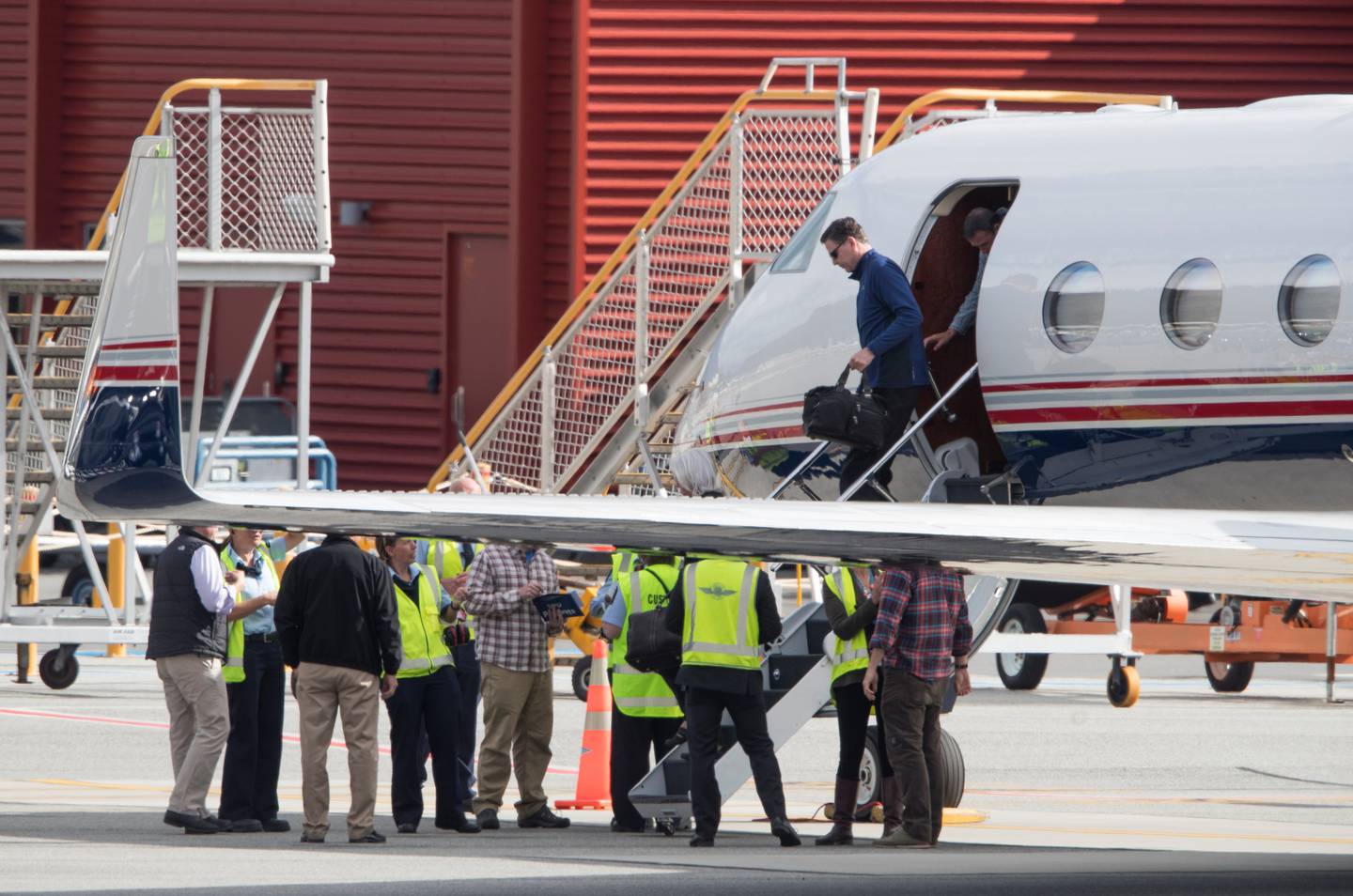 FBI director James Comey disembarks from a Gulfstream jet after touching down on the tarmac at...