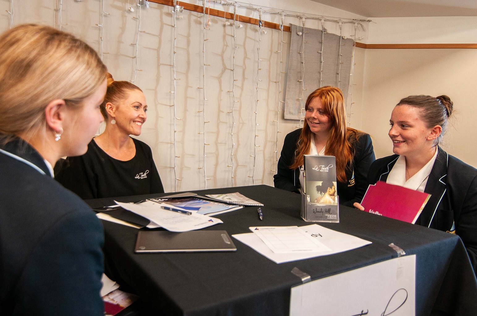 LaTouch owner Juliet Kavanagh chats with Cromwell College Year 12 pupils (from left) Olivia...