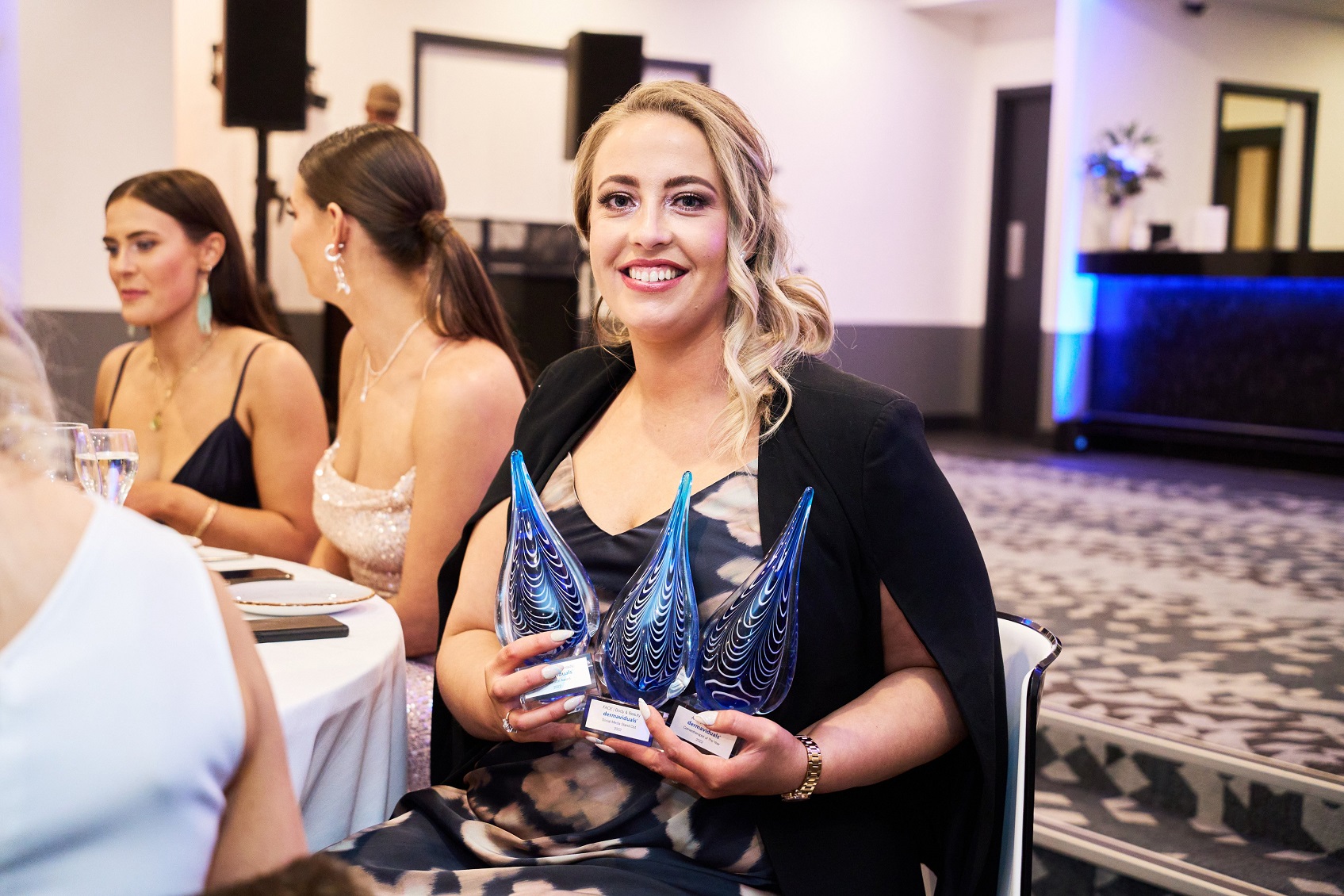 Annalysse Mitchell, of Face Body and Beauty, in Balclutha, with the award she won at the...