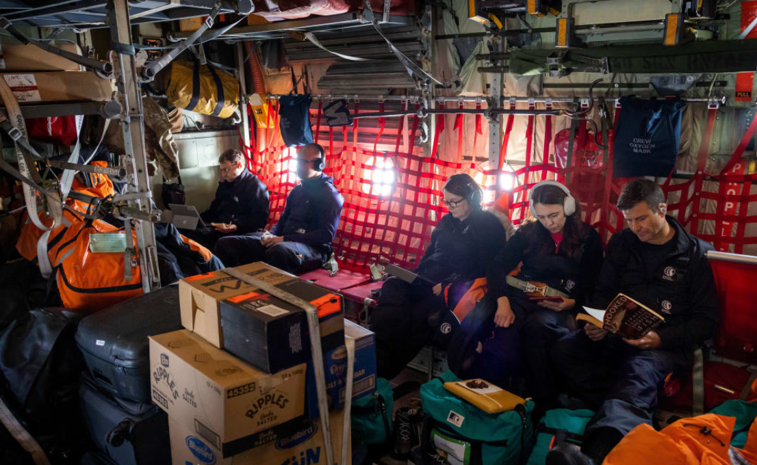 Prime Minister Jacinda Ardern (top, second right) and partner Clarke Gayford aboard the Royal New...