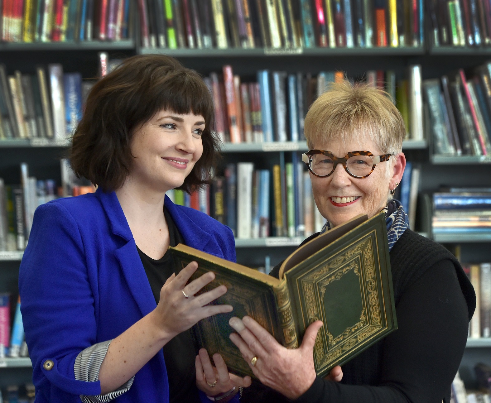 Otago Girls’ High School librarian Monique Patterson (left) and former pupil Margaret Cassie hold...