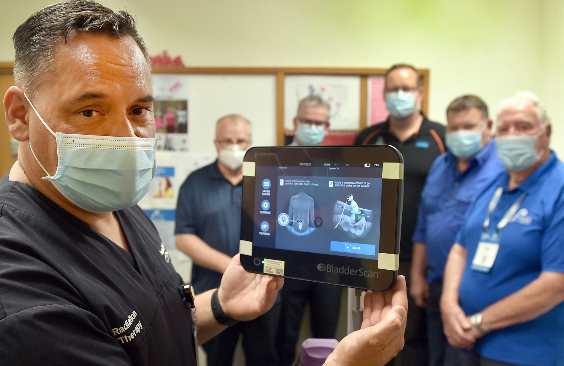 Radiation Therapist Andre Aumata shows off the Dunedin Hospital's new bladder scanner alongside ...