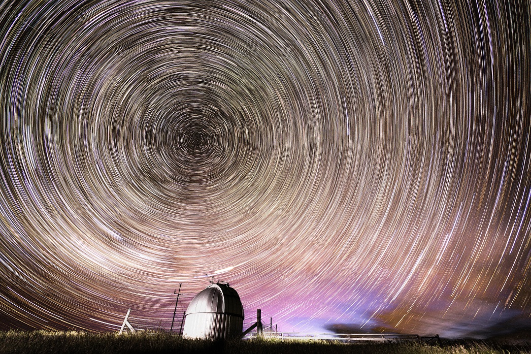 The galaxy swirls above an instrument used to measure ozone in the atmosphere, at Niwa’s...