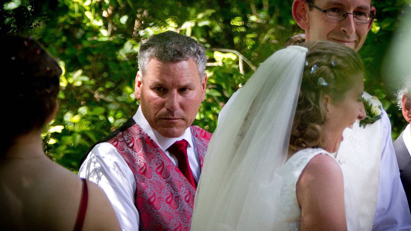 Groomsman Paul Wilson (left) with David Bain and Liz Davies after their wedding ceremony in...