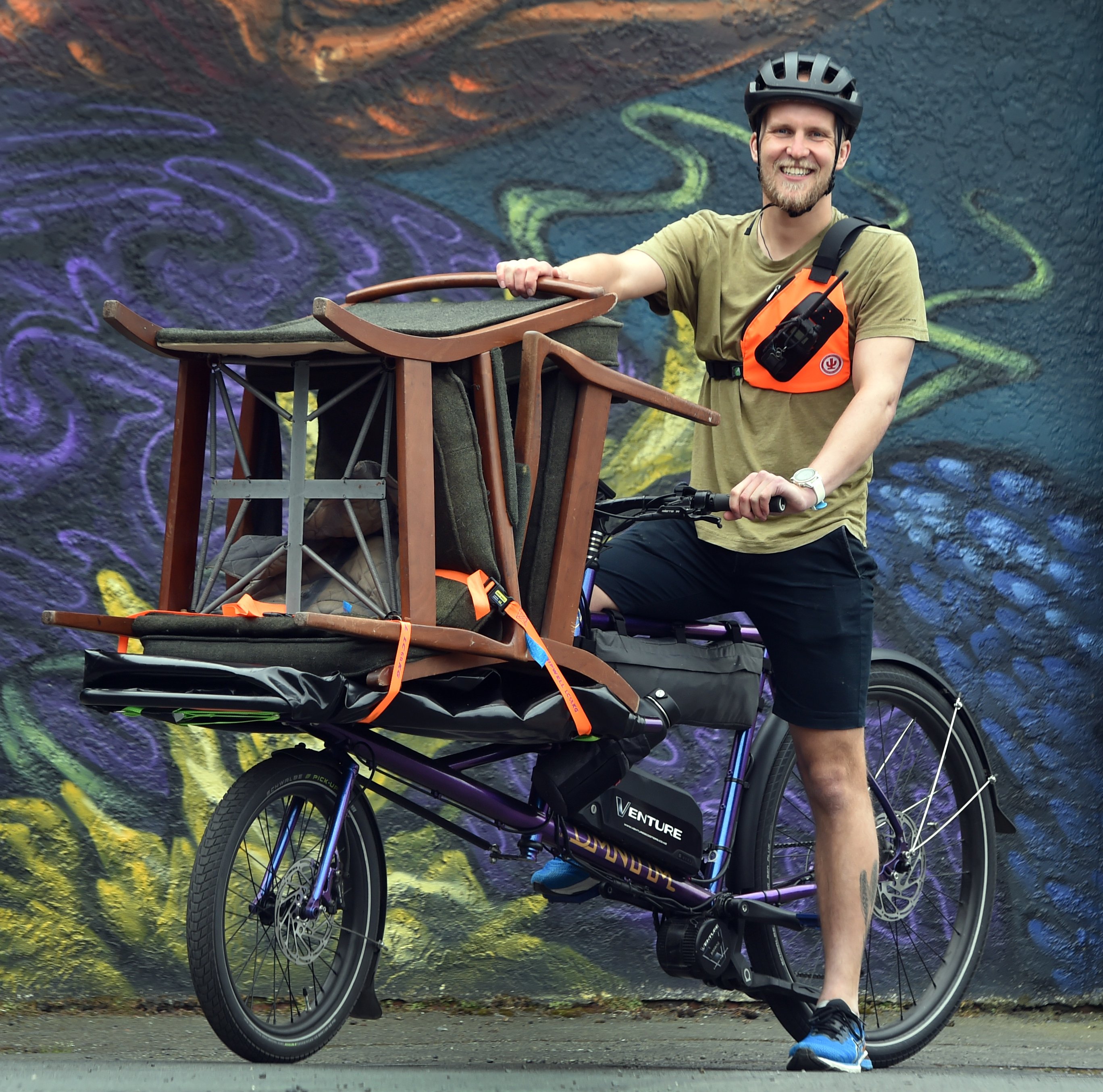 Pedals Dunedin founder Liam Harrison makes deliveries around the city yesterday. PHOTO: PETER...