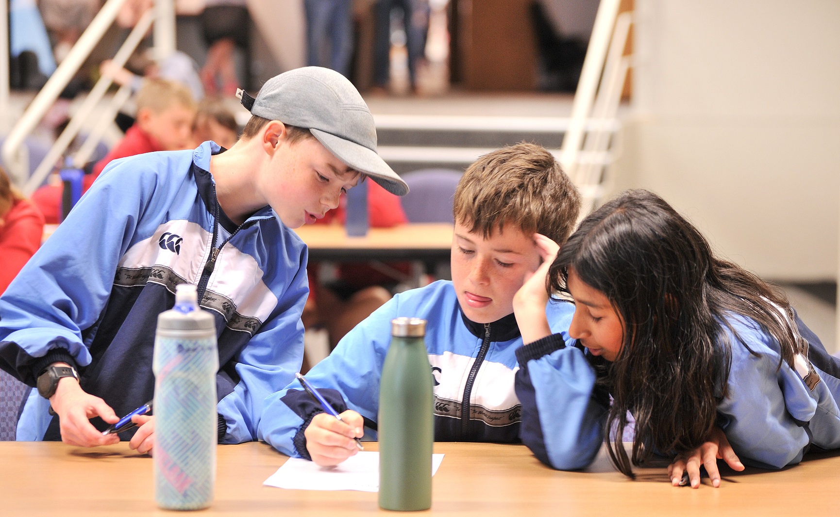 Ben Walker (10), Lochie Grant (11), Meghna Nair (11) of George Street Normal school work on...