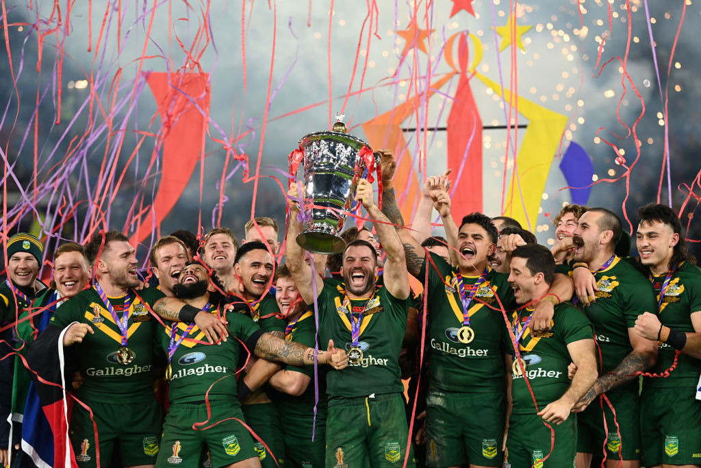 The Australian players celebrate with the trophy after their victory over Samoa at Old Trafford in Manchester. Photo: Getty Images