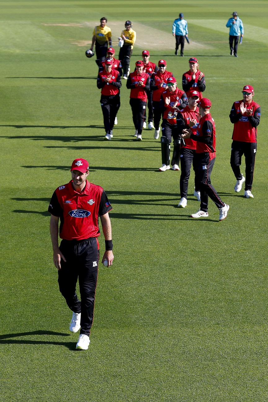 Henry Shipley is applauded by his Canterbury team-mates after taking six wickets, including a hat...