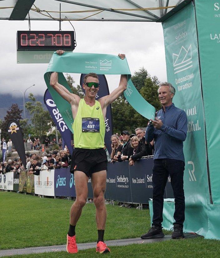 Marathon winner Daniel Jones crosses the finish line at the Queenstown Rec Ground. Photo: Sportograf