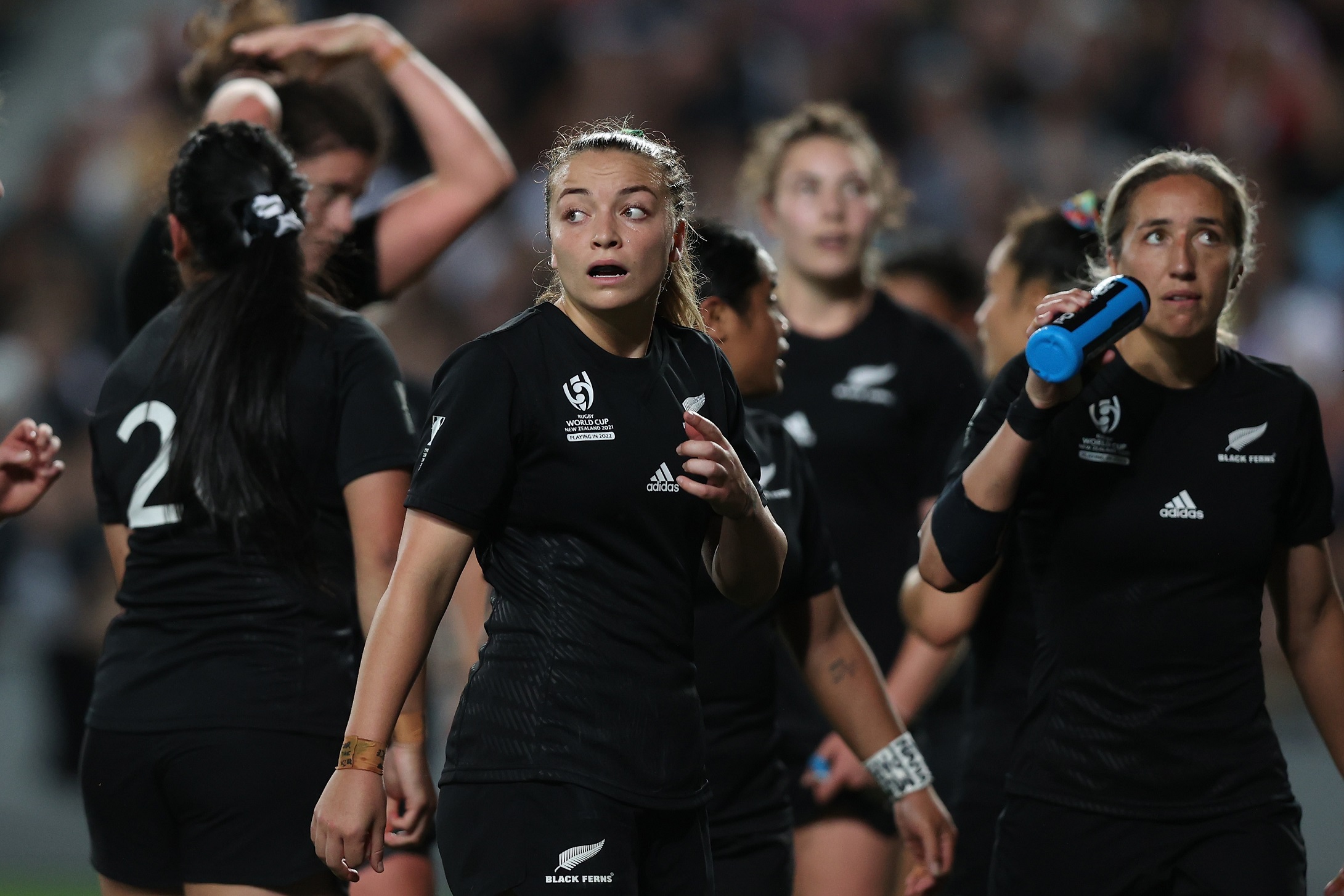 Renee Holmes of the Black Ferns looks on.