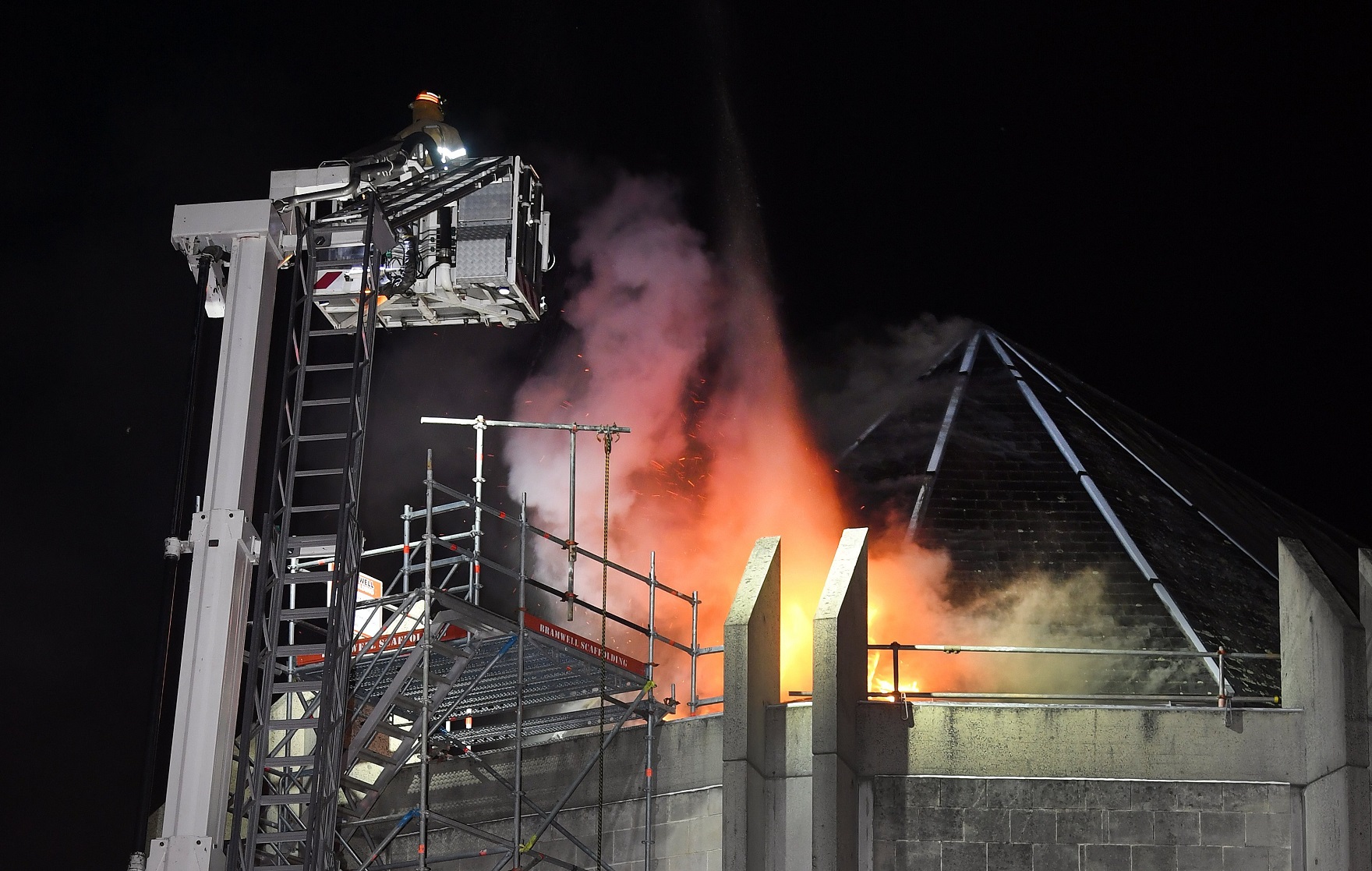 Firefighters prepare to make an aerial attack on the fire at St Paul’s Cathedral roof at 3.30am...