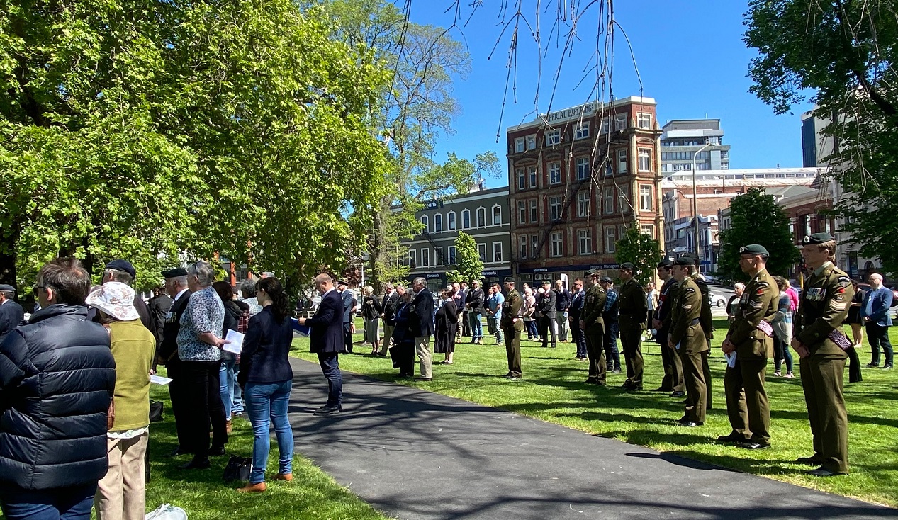 Members of the New Zealand Defence Forces stand alongside a crowd of about 400 people at Friday’s...