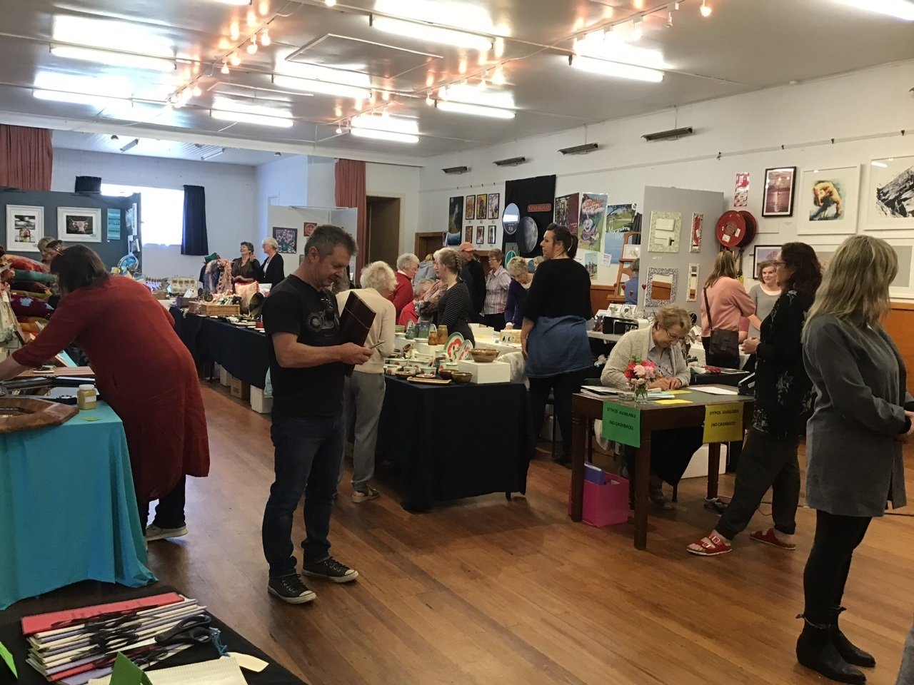 Visitors browse the artworks at a previous OpenArts Annual Art Fair. Photo: Supplied