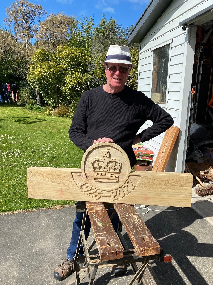 Artist and environmentalist Vic Mills holds the completed back-rest for a bench seat,...