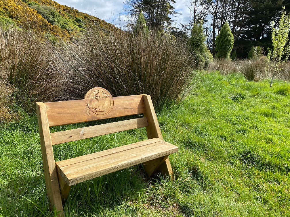 One of the carved wooden seats made by Vic Mills for walkers in the Future Forest.