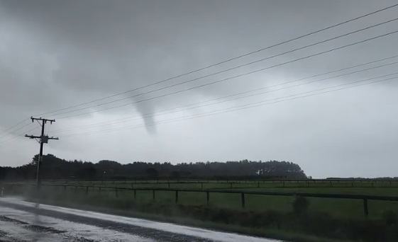 A truck driver moving south outside Urenui has captured a tornado over Taranaki. Screengrab from...