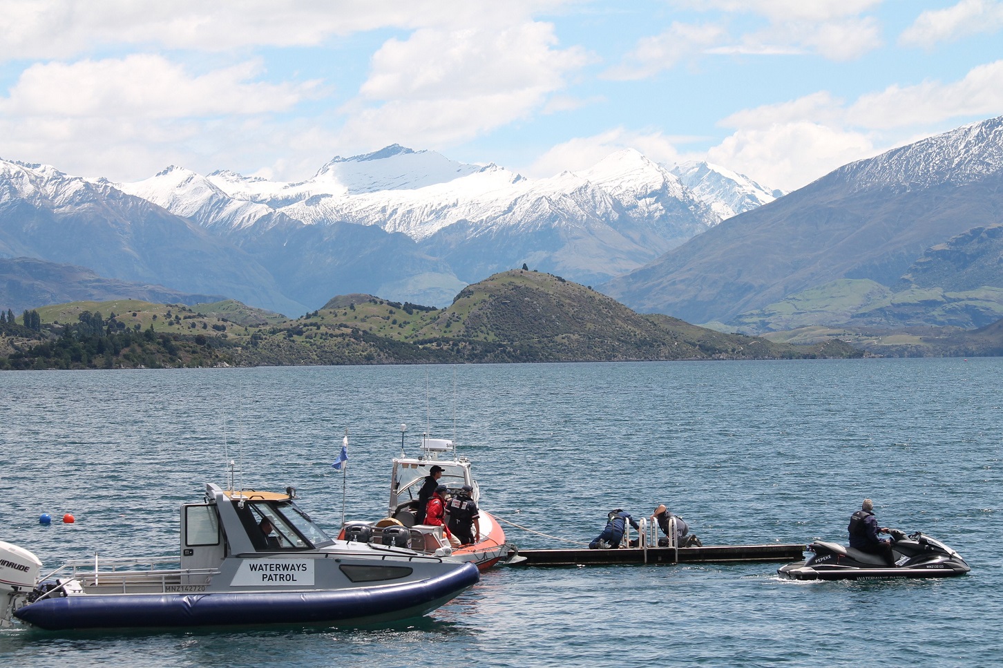 Waterways Patrol, Coastguard and police prepare for the diving squad to bring a missing swimmer's...