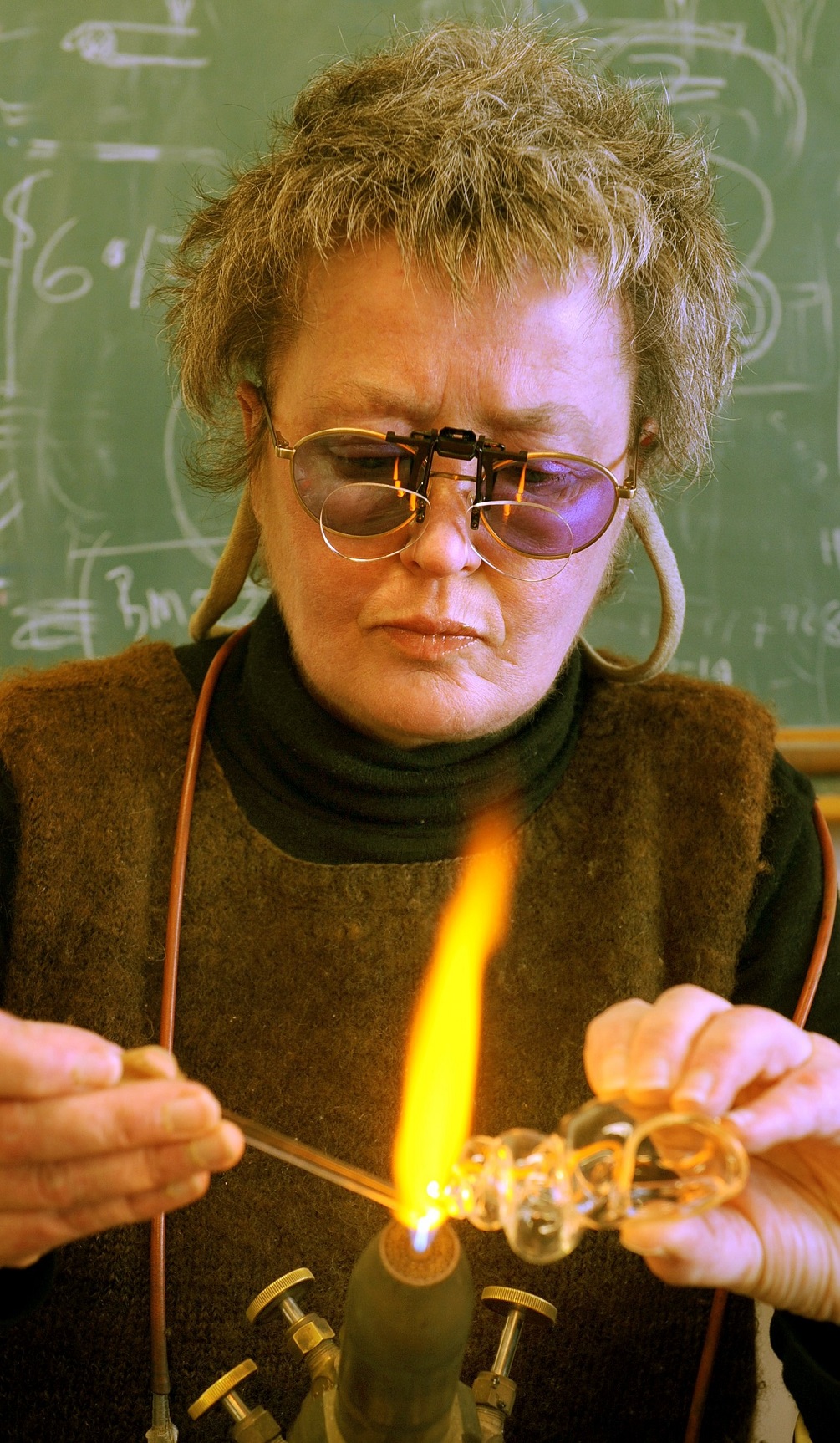 University of Otago glassblower Anne Ryan in 2009 works on a glass shell for a hermit crab living...