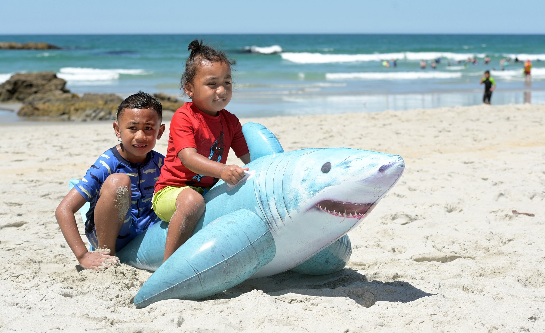 Brothers Xavier (5, left) and Lennox (3) Fa’amoe-Ioane, of Dunedin, sit on an inflatable shark on...