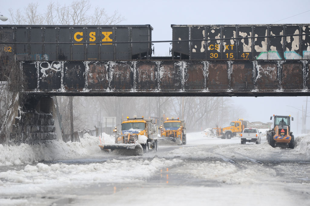 Ploughs work to clear ice and snow along the Lake Erie shoreline on Christmas Eve in Hamburg, New York. Photo: Getty Images