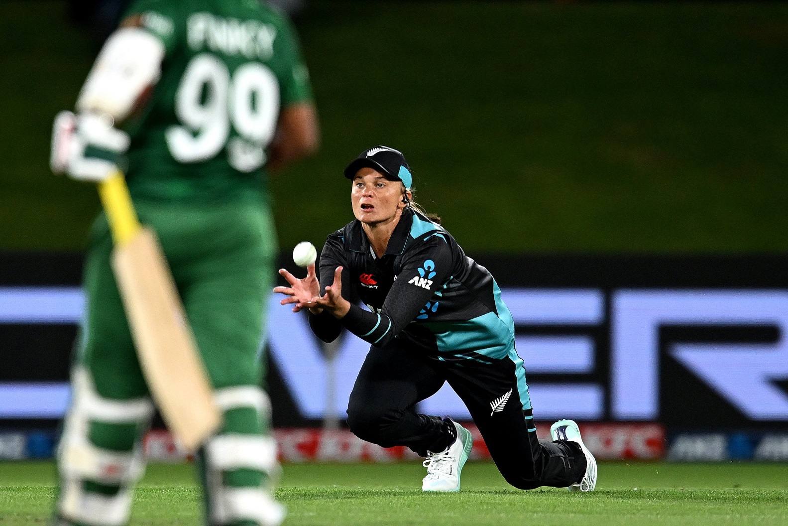 New Zealand’s Suzie Bates dives to take a catch from Lea Tahuhu’s bowling to dismiss Fargana...