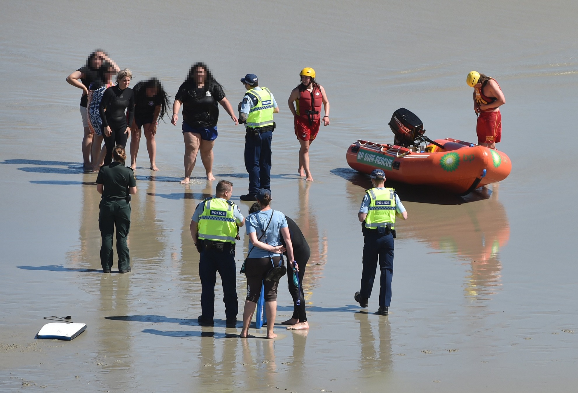 Emergency services at the scene of a beach rescue at St Kilda Beach yesterday. Photo: Gregor...