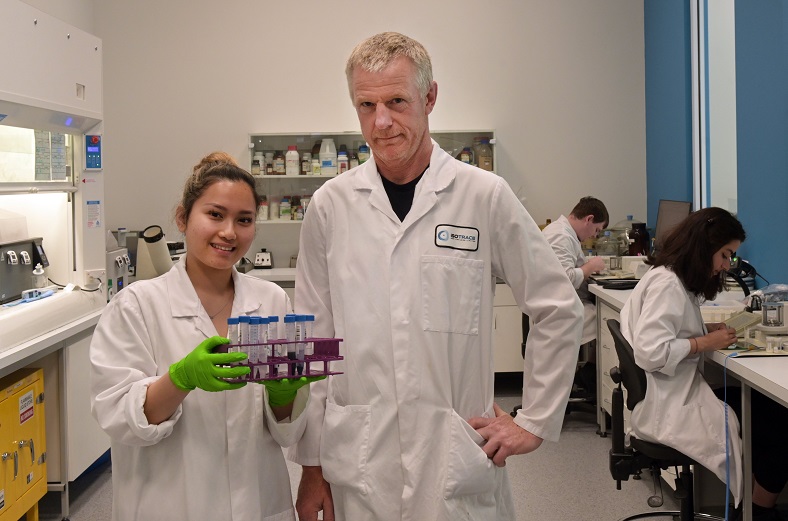 Senior lab technician Elita Piseth looks at samples with technical manager Robert Van Hale at...