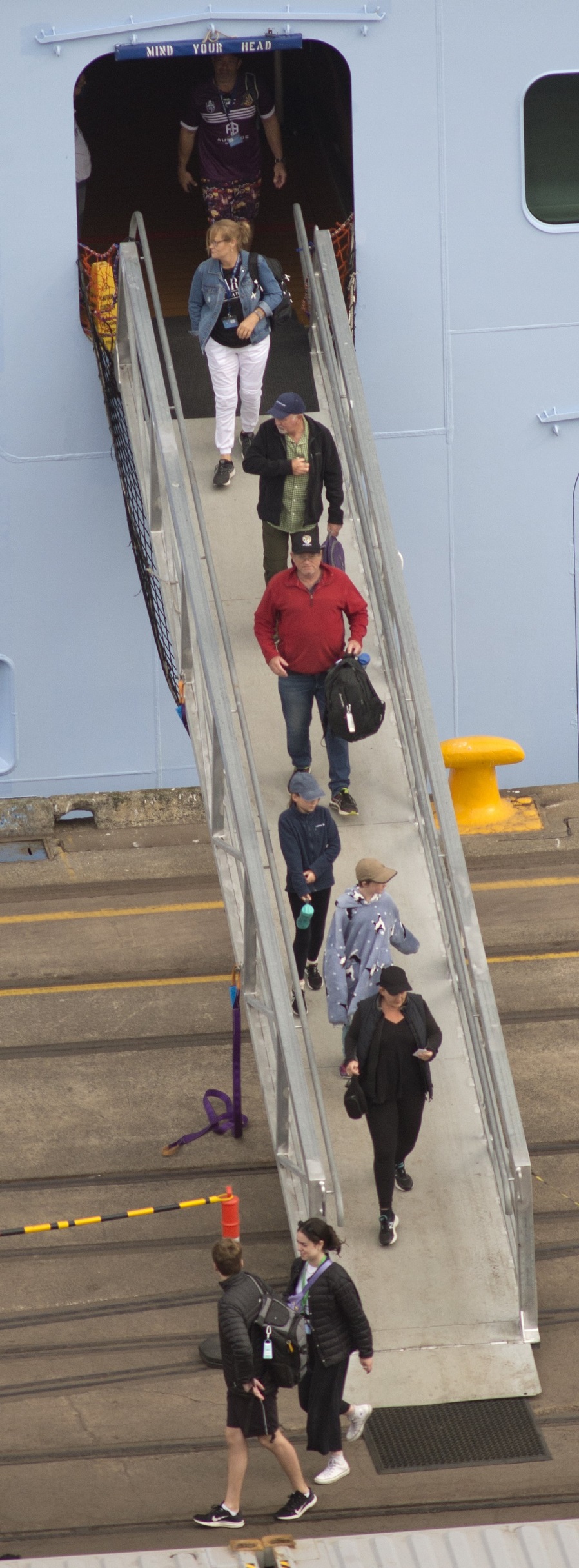 Passengers disembark at Port Chalmers yesterday morning.