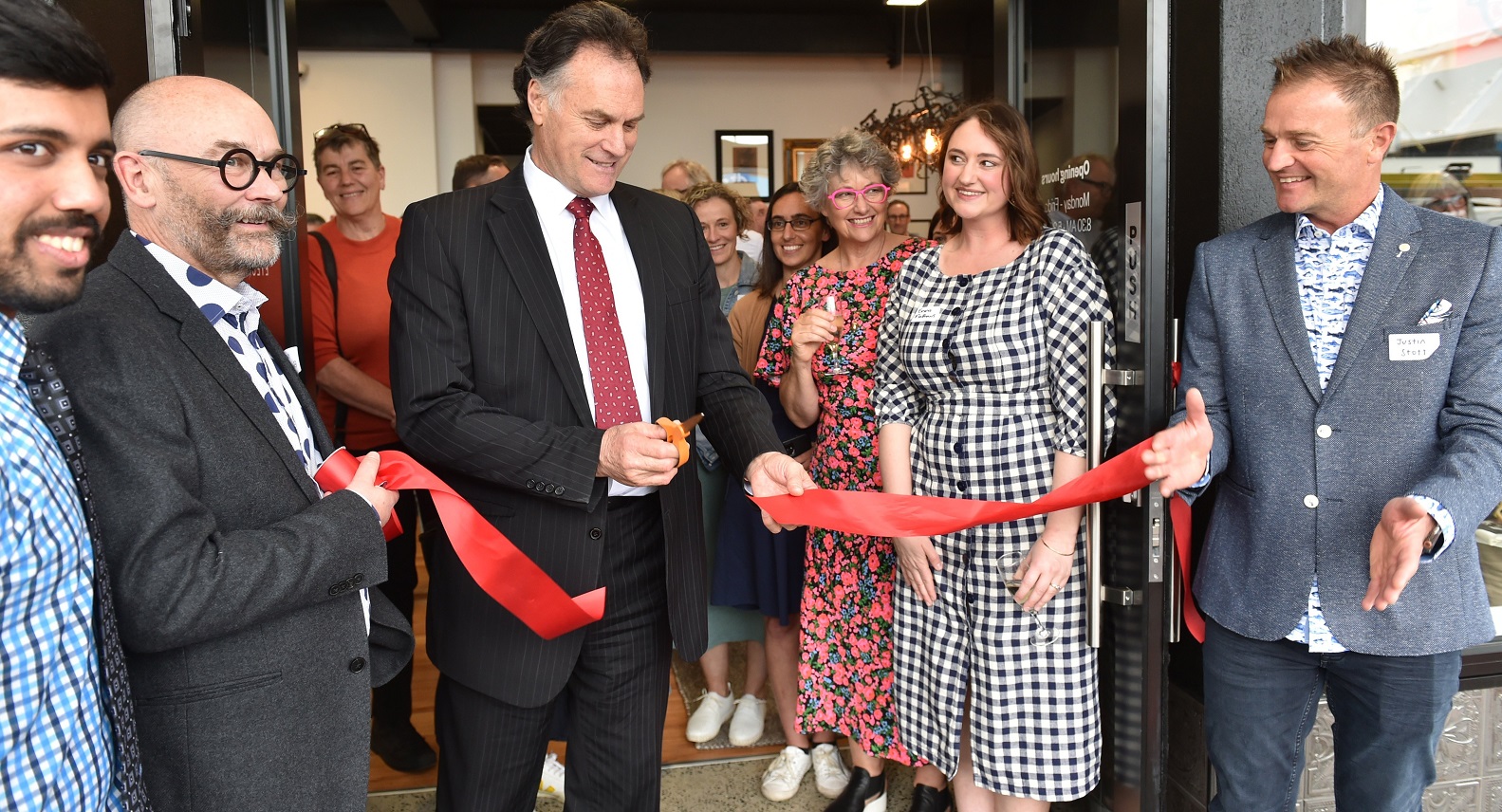 Watching Dunedin Mayor Jules Radich cut the ribbon to open a refurbished historic South Dunedin...