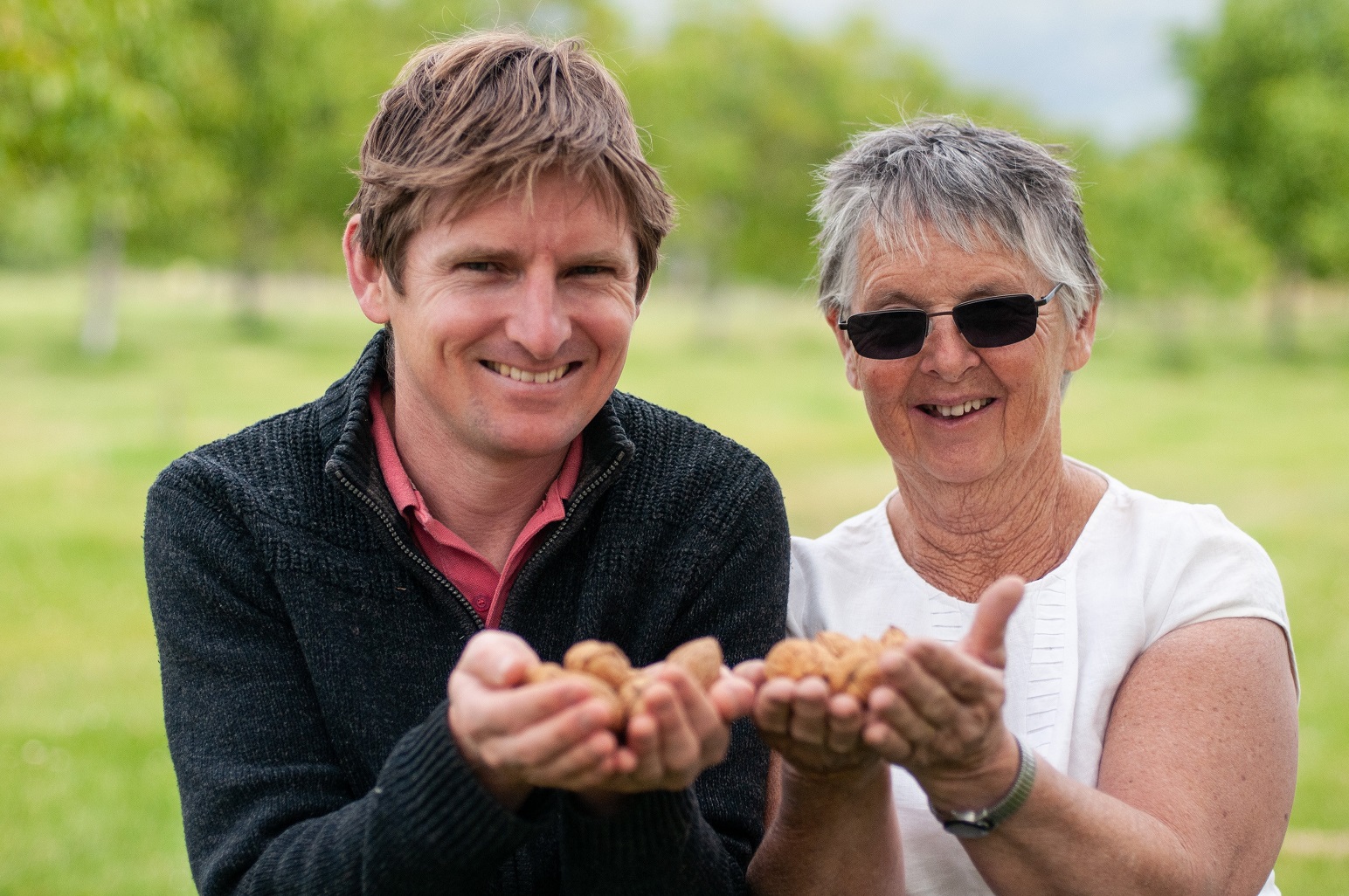 NZ Nuts owner Valda Muller and son Tim show off some of their walnut orchard’s bounty. Photo:...