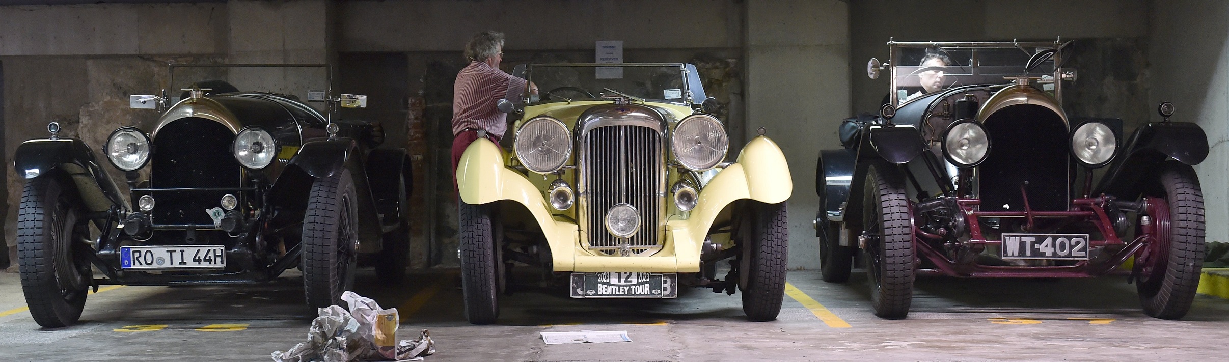 Bentley owners work on their rides during a tour of the country in Dunedin yesterday.