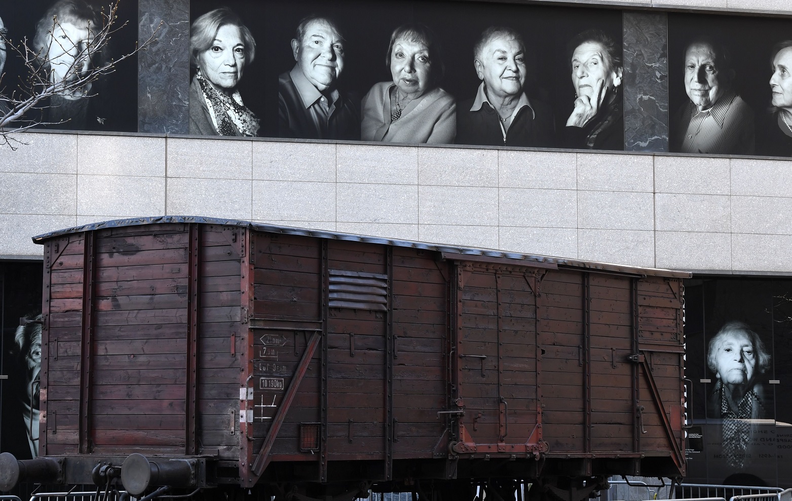 Portraits of Holocaust survivors are displayed at New York’s Museum of Jewish Heritage, beside a...