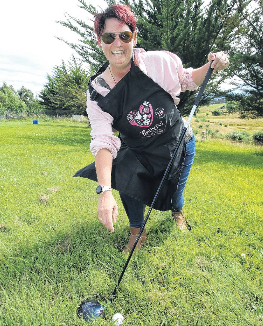 Driving for others . . . Bellyful Waimakariri branch co›ordinator Carol Burdon practices her golf...