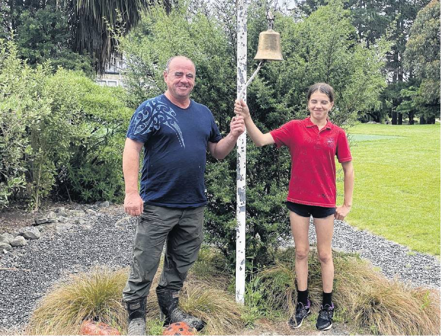 Final ring . . . Peyton (PJ) Mackintosh 13, rings the North Loburn School bell with her father,...