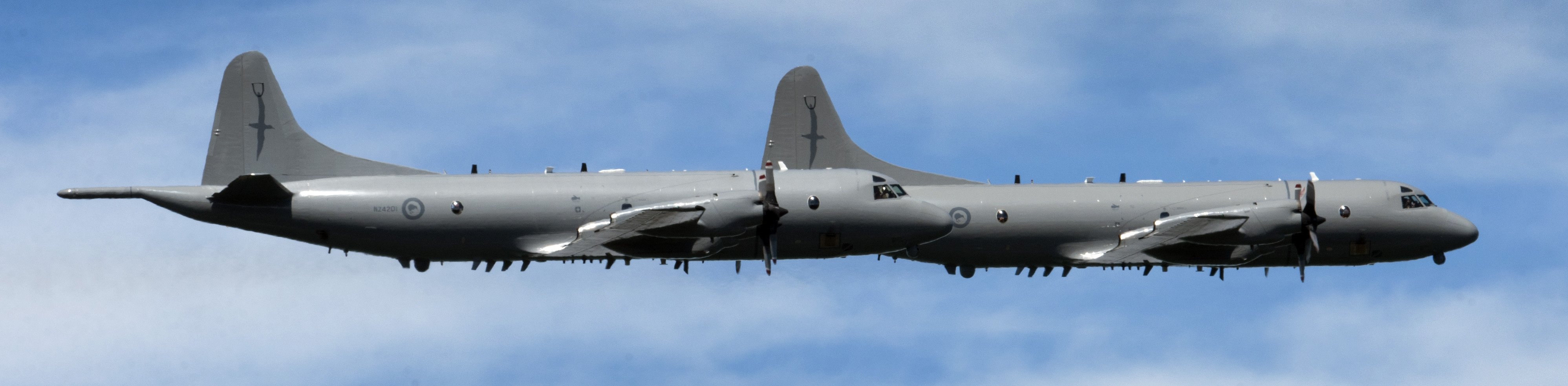 A pair of Royal New Zealand Air Force Orions fly over Dunedin in tight formation during a...