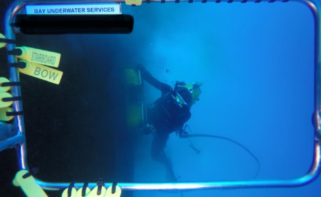 Bay Underwater Services divers cleaning a ship's hull. Photo: Bay Underwater Services NZ Limited ...