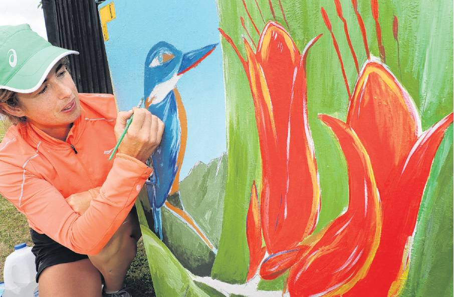 Gently does it . .. Woodend artist Angela Doig works on the second Chorus telephone cabinet she...