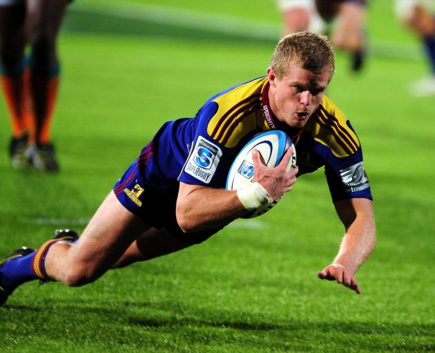 Kendrick Lynn crosses for a try for the Highlanders against the Cheetahs at Carisbrook in 2011....